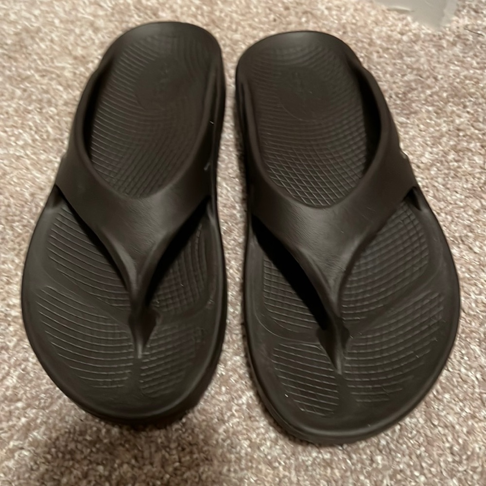 Brown Oofos flip flops
